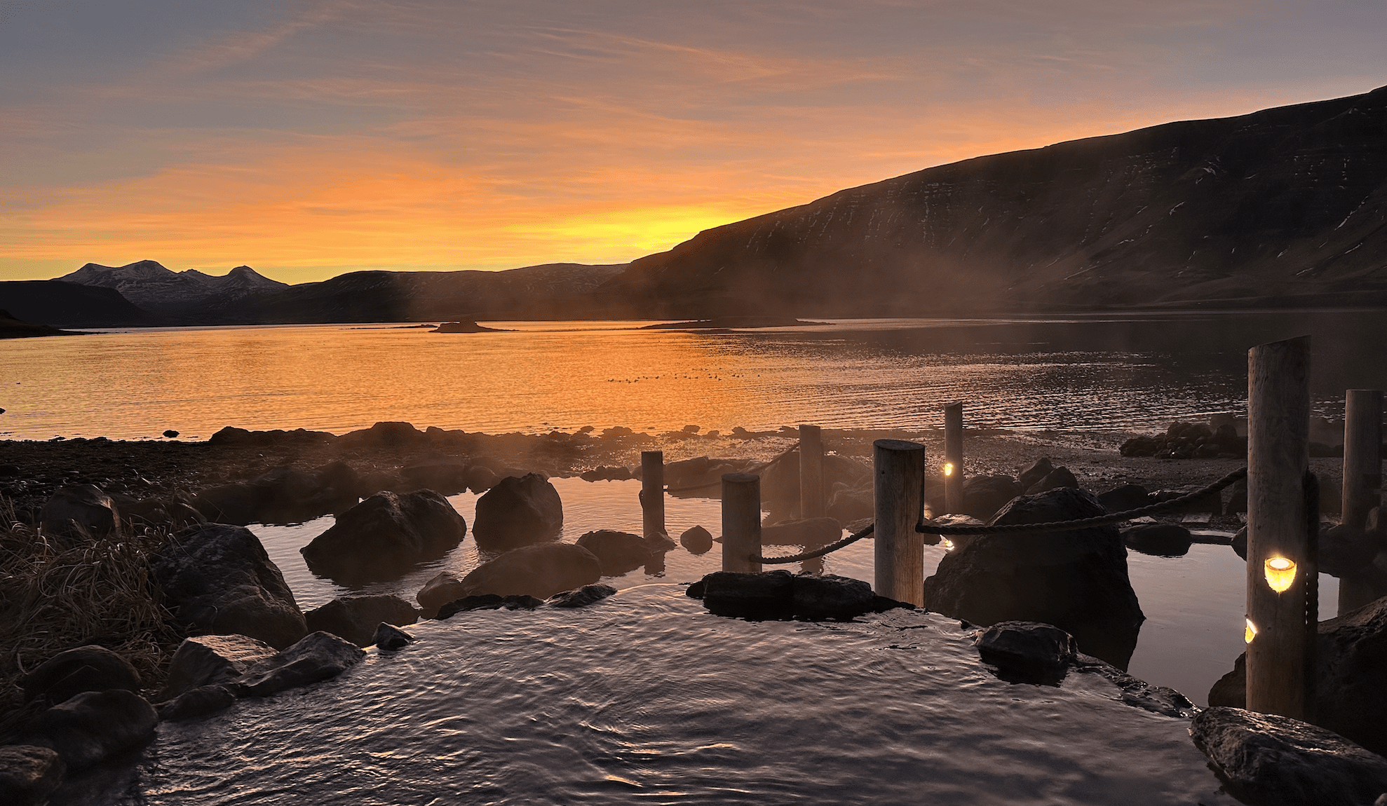 Iceland Hot Springs. Hvalfjörður lagoon next to it, the mountains further away on the horizon. Customer Reviews